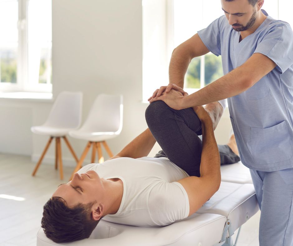 Patient being treated for hip pain by physical therapist.